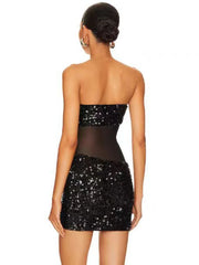 The slim fit of the dress, highlighting its flattering silhouette.