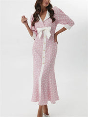 Slim-fit  pink party dress styled indoors against white backdrop