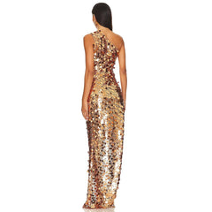 Asymmetrical gold dress styled for an elevated evening look