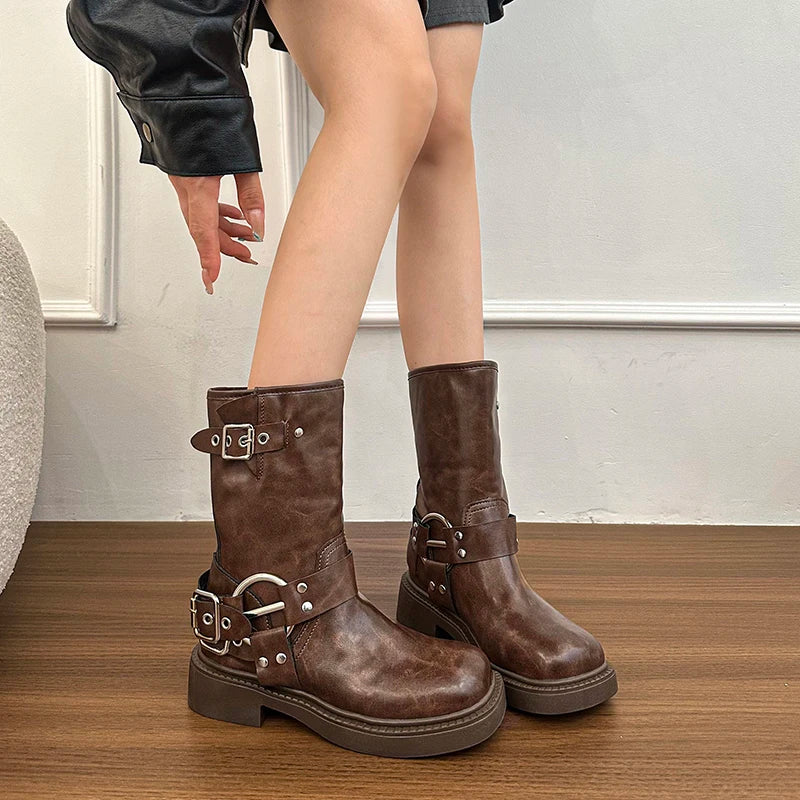 Casual, durable urban biker boots styled for spring and autumn wear, worn by a person on a wooden floor.