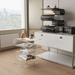 Minimalist acrylic end table styled in a small living room