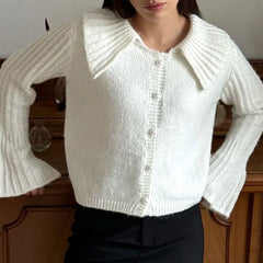 Soft button down knit sweater for women shown with casual trousers