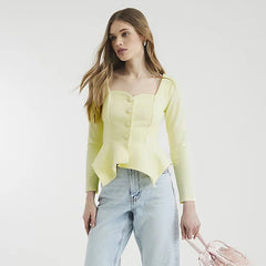 A close-up of the ruched detail on the solid-color top.
