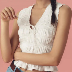 A full-length shot of a solid-color slim-fit camisole styled for a casual day out.