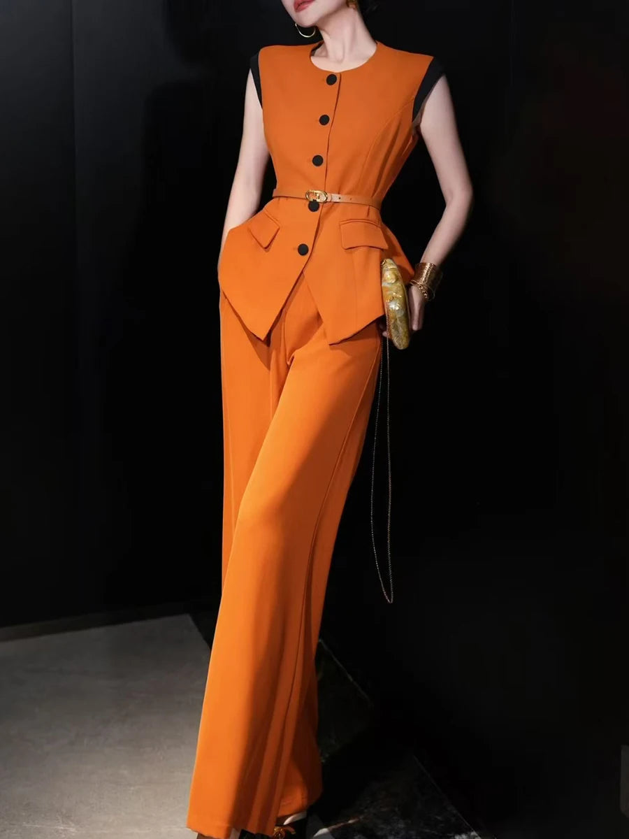 A woman modeling a solid two-piece set with a round-neck top and a pair of high-waist pants.