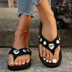Top view of glamorous wedge sandals with crystal heart detail