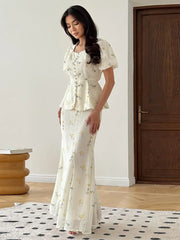 A close-up shot of the square collar and the ruched lace-up details on the top.