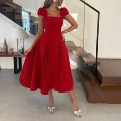 Pleated skirt detail on a square-neck A-line midi dress in motion