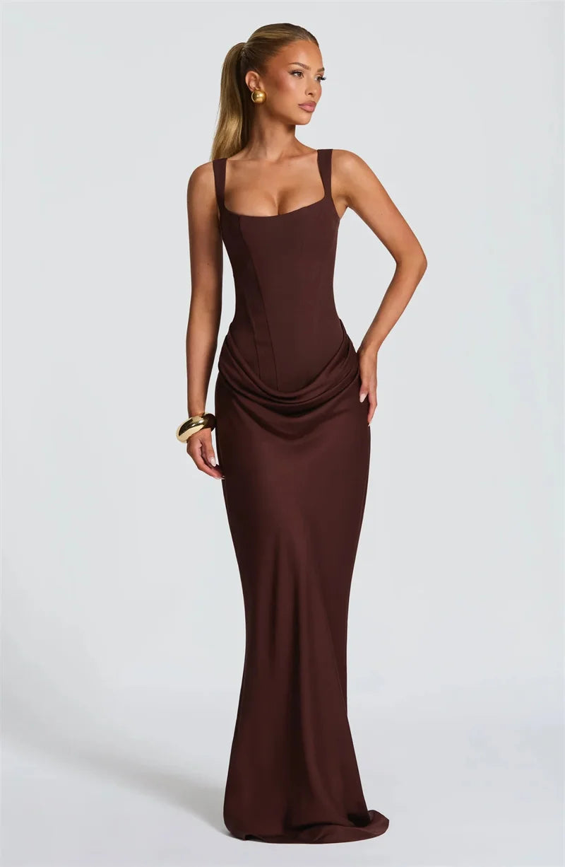 Woman wearing a brown evening gown on a white background