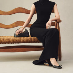 Statement black evening bag with ring handle shown for minimal accessorizing