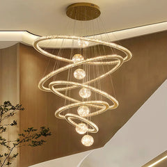 Statement ceiling crystal light for large entryway or double height home  hanging from a ceiling with a neutral background