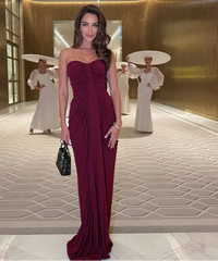 Elegant women’s maxi dress in burgundy with dramatic pleats