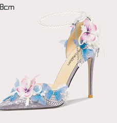 Statement garden event pumps for women with blue, pink, and white blossoms
