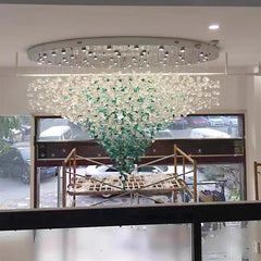 Statement crystal fixture with green accents for large living rooms