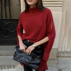 Side-angle view highlighting the relaxed fit and high neckline of the sweater