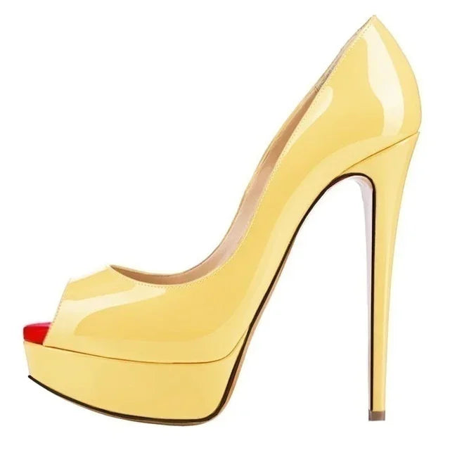 Yellow stiletto high heel wedding party shoe in peach patent leather on a white background