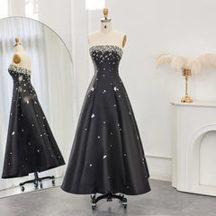 The full length of the strapless A-line formal dress on a model.