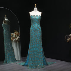 A close-up shot of the strapless bodice, showing the intricate beading and sequin details.