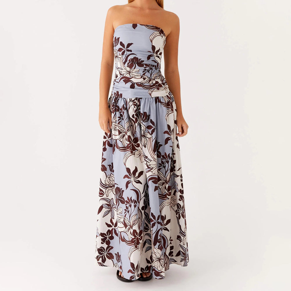 Woman in a floral strapless maxi dress styled for summer events