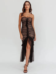 A model wearing a black strapless lace draped open-shoulder midi dress with a sweetheart neckline and 3/4 sleeves, featuring an open back.