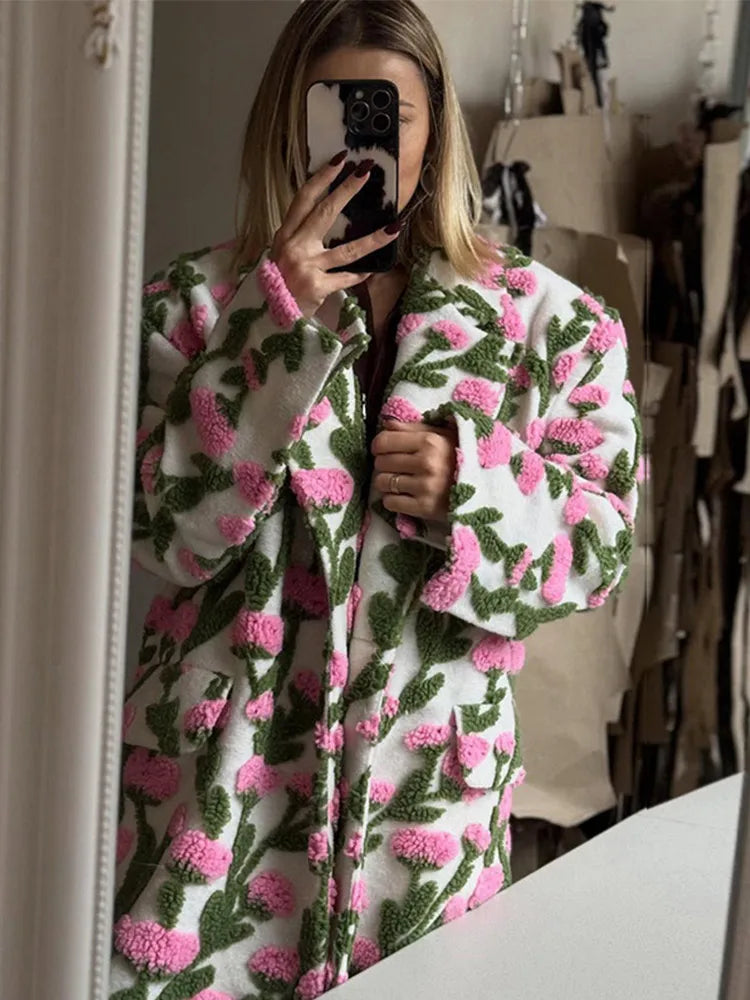 Three-quarter angle of a plush floral jacket paired with tights and boots, highlighting the roomy silhouette and everyday street styling.