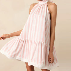 A woman modeling a striped cold-shoulder mini tank dress.