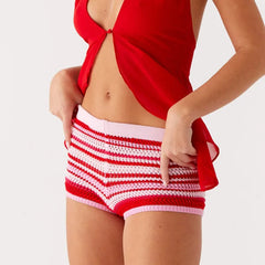 A close-up of the striped pattern and knit texture of the shorts.