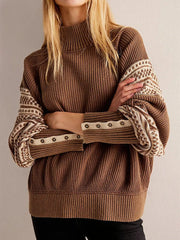 Close-up on the sweater’s sleeve showing crisp stripe pattern placement and textured knit finish with a clean, structured drape.