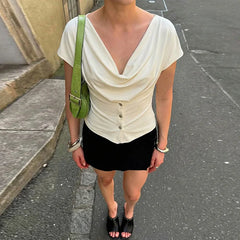 Structured off-shoulder blouse with subtle pleating through the bodice