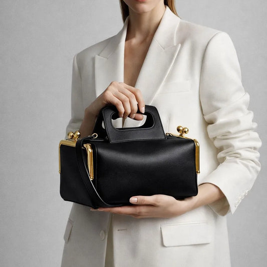 structured top handle shoulder bag with rectangular silhouette and hasp closure