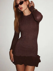 A brown dress with a stylish ruched and tiered design.