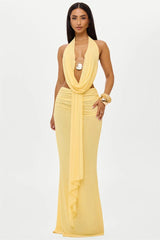 A woman wearing a stylish maxi skirt set.