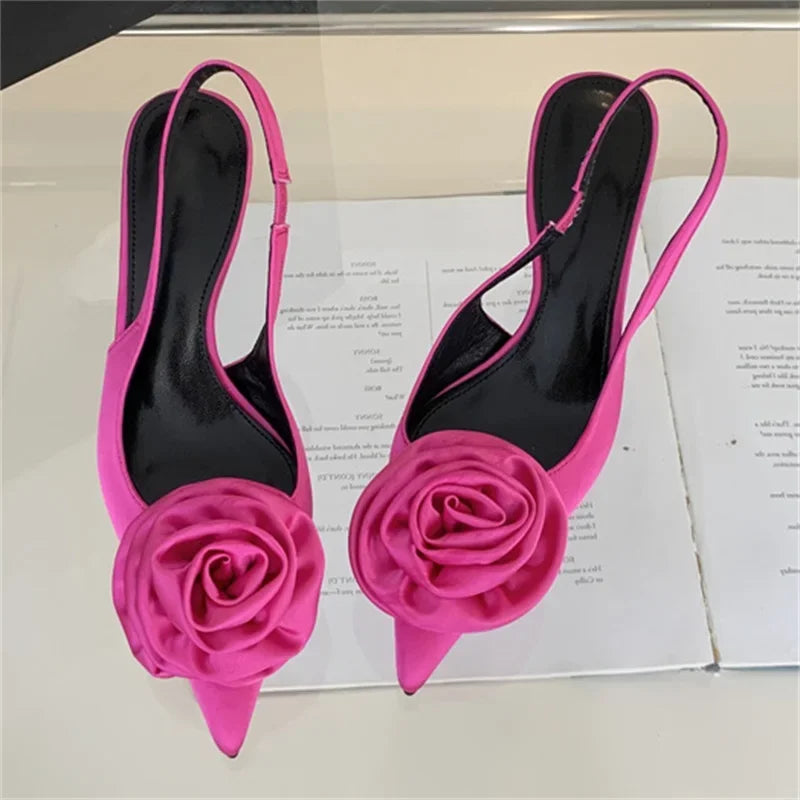 A pair of stylish satin pumps with a fashionable design.