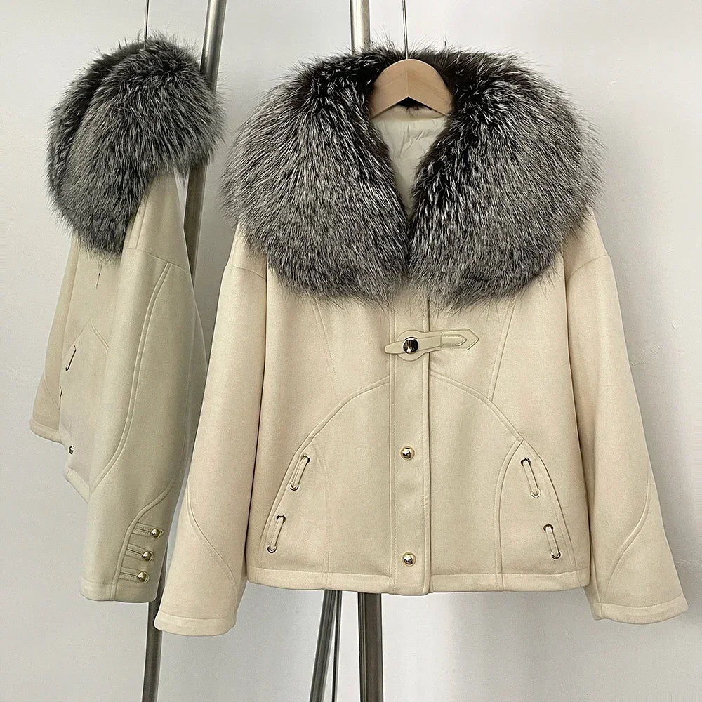 Detail view of pockets and suede texture on a beige down jacket.