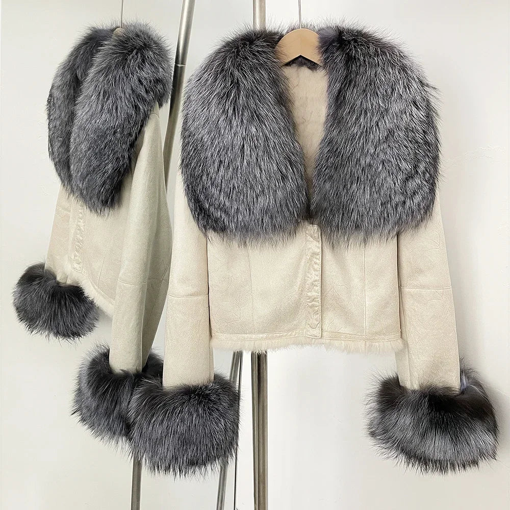Studio image of a cropped suede jacket with fur trim, presented under neutral lighting to show shape and finish