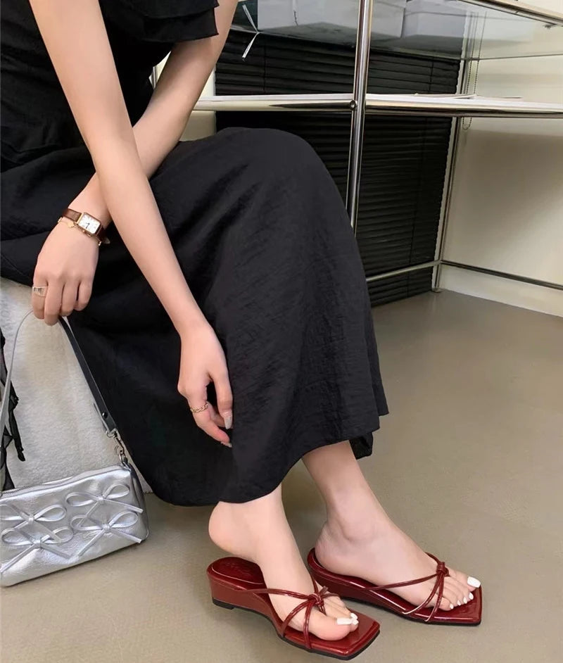 Women’s red wedge flip flop slides with narrow straps