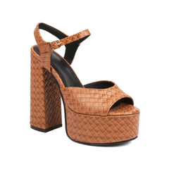 Super high woven sandal designed for bold vacation or brunch style
