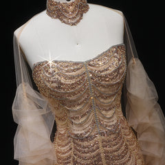 Mannequin wearing a beaded evening gown with a necklace on a black background