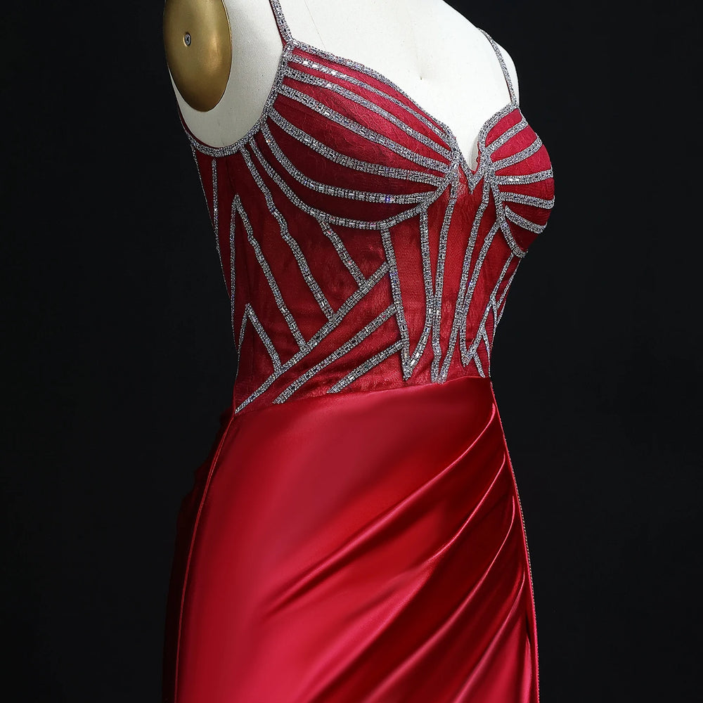 Sweep train detail on satin mermaid prom gown with fitted silhouette