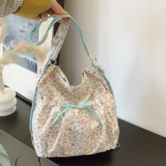 Floral print shoulder bag with bow detail