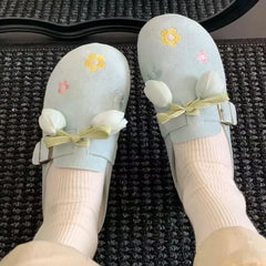 Front view of sweet lace-up flower closed toe slides for women