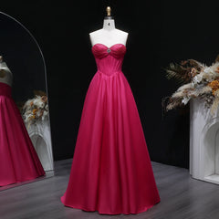 Floor-length satin prom gown with sweetheart neckline and crystal beading