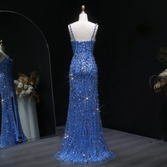 Floor-length embellished prom gown with slit detail against dark backdrop