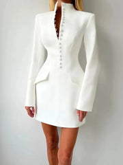 Close-up of the button-up front detailing on a tailored blazer mini dress with a sleek, structured finish.