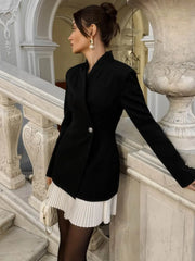 Full view capturing the long sleeves, single-button closure, and tailored silhouette as the dress falls cleanly above the knee.