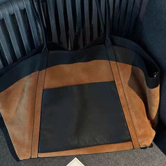 Textured cotton and leather handbag designed for versatile use