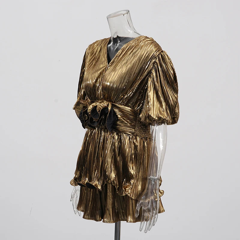 Detail view of the gold shorts showing the elastic waistband and comfortable, loose fit.