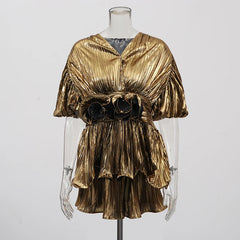 Close-up of the gold co-ord top highlighting the three-dimensional floral texture and soft woven fabric.