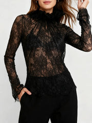 Close-up of the lace texture and subtle shirring across the bodice showing the garment’s delicate pattern and soft structure.