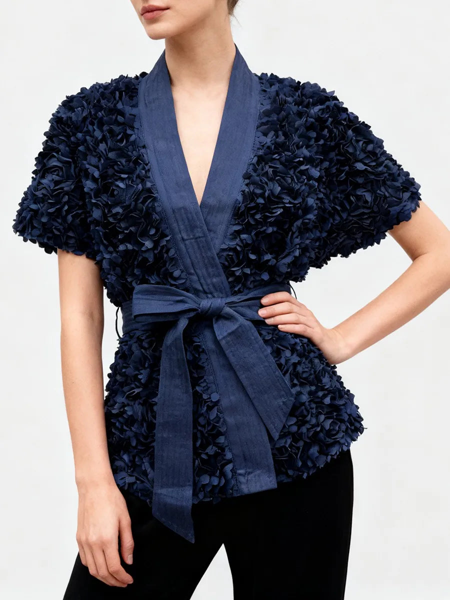 Floral appliqué tunic top styled with black trousers